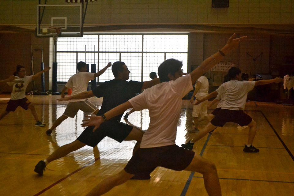 Boys fencing team practicing their lunges during practice. Photo taken by Fran Horowitz. 