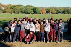 Boys xc team poses with their second place trophy. Photo by Karen Su