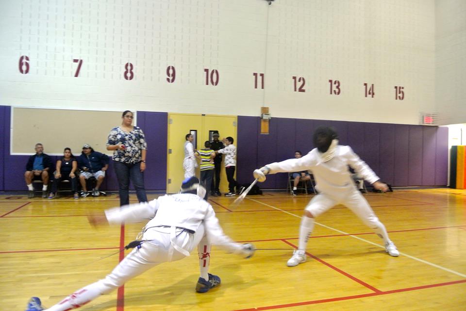 Senior Jordan Brandwein attempts to make a touch on his lunging opponent. Photo by Rebekah Jones