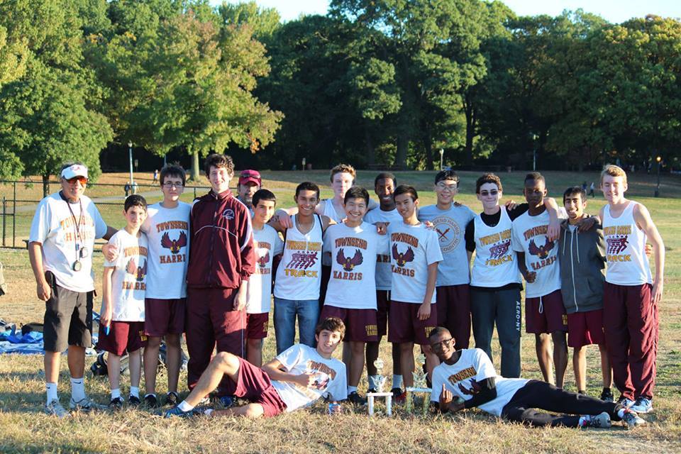Boys XC freshmen and sophomores pose with their second and first place trophy respectively. Photo by Yash Sharma