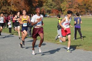 Freshman Justice Williams running in the Freshman Sophomore City Championships. Photo by Yash Sharma