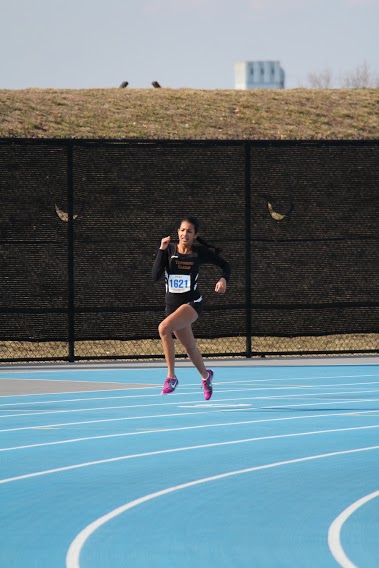 Sophomore Yasmeen Ally medals in the 400 m dash. Photo by Yash Sharma.