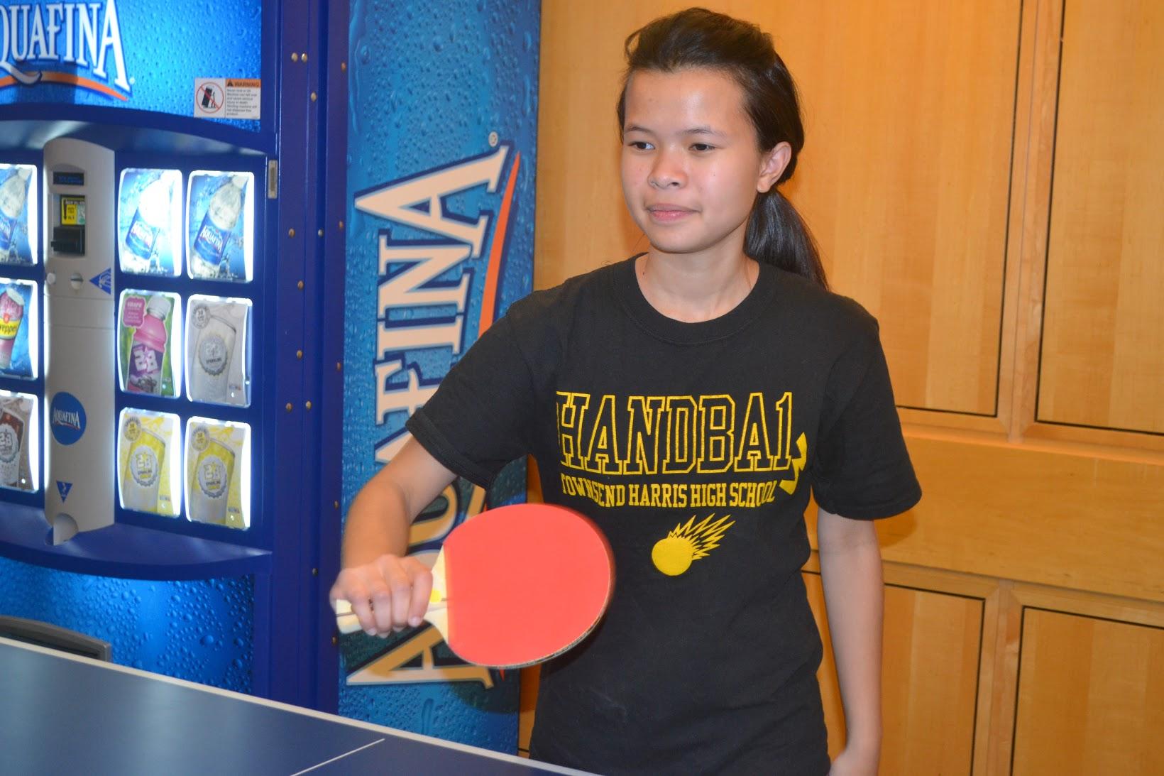 The girls table tennis team at practice in the teachers’ cafeteria.