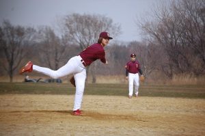 Freshman Alex Lebeau, who pitched in the first playoff game, delivers a knuckleball.